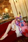 Rating: s Score: 1 Tags: 1girl asian cosplay couch crescent dress female hat highres long_hair patchouli_knowledge photo purple_hair solo tenshi_myu touhou