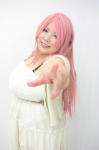 Rating: s Score: -1 Tags:  1girl belt blue_eyes breasts cleavage dress fat huge_breasts long_hair luu_(cosplayer) photo pink_hair pointing smile solo 