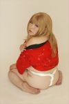 Rating: q Tags: 1girl asian blonde_hair fat luu_(cosplayer) photo solo sumo